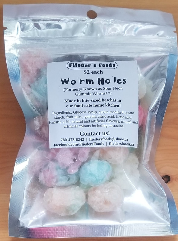 Freeze dried Worm Holes (previously known as sour neon gummy worm candies), in zip close mylar pouch